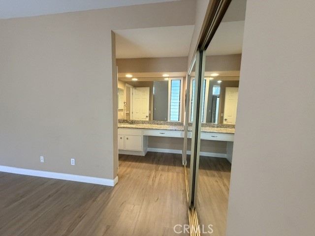 Primary bed/bath - mirrored closet doors - 8566 Larkhall Circle 813B, Huntington Beach CA 92646 - photo 25
