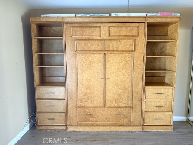 Guest bedroom - Murphy bed (included) - 8566 Larkhall Circle 813B, Huntington Beach CA 92646 - photo 32