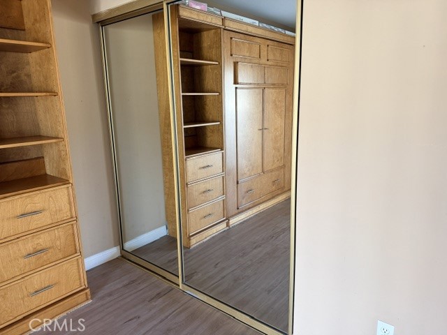 Guest bedroom - mirrored closet doors - 8566 Larkhall Circle 813B, Huntington Beach CA 92646 - photo 33
