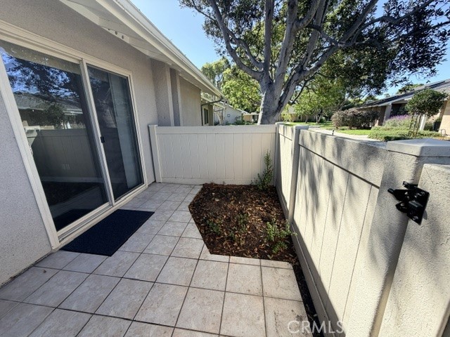 Back patio - secondary access to home - 8566 Larkhall Circle 813B, Huntington Beach CA 92646 - photo 35