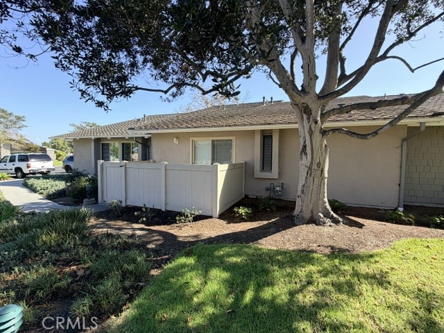 Back patio and secondary access off Guest bedroom; close to additional parking - 8566 Larkhall Circle 813B, Huntington Beach CA 92646 - photo 36