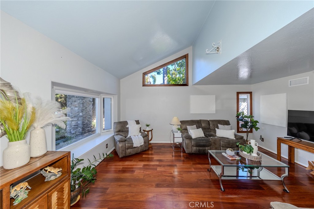 Living Room with Vaulted Ceiling and Bay Window. - 8712 Mossford Dr., Huntington Beach CA 92646 - photo 4