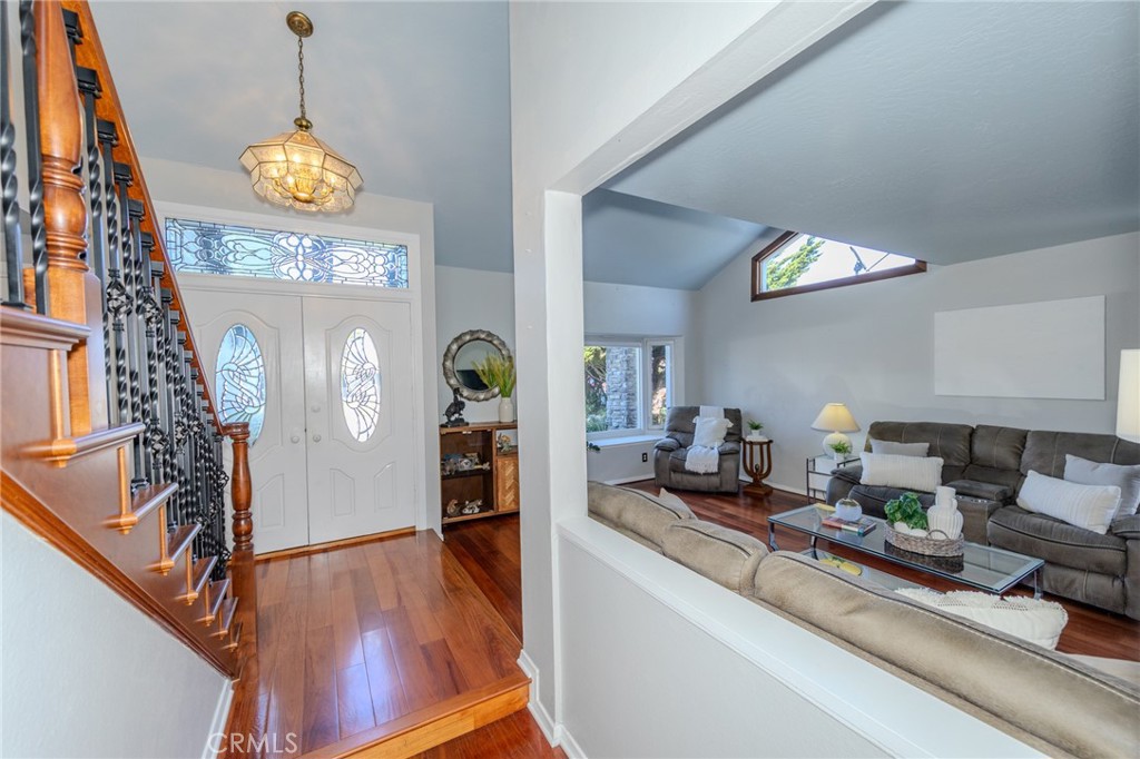 Looking into the Entryway and Living Room from the Family Room - 8712 Mossford Dr., Huntington Beach CA 92646 - photo 7