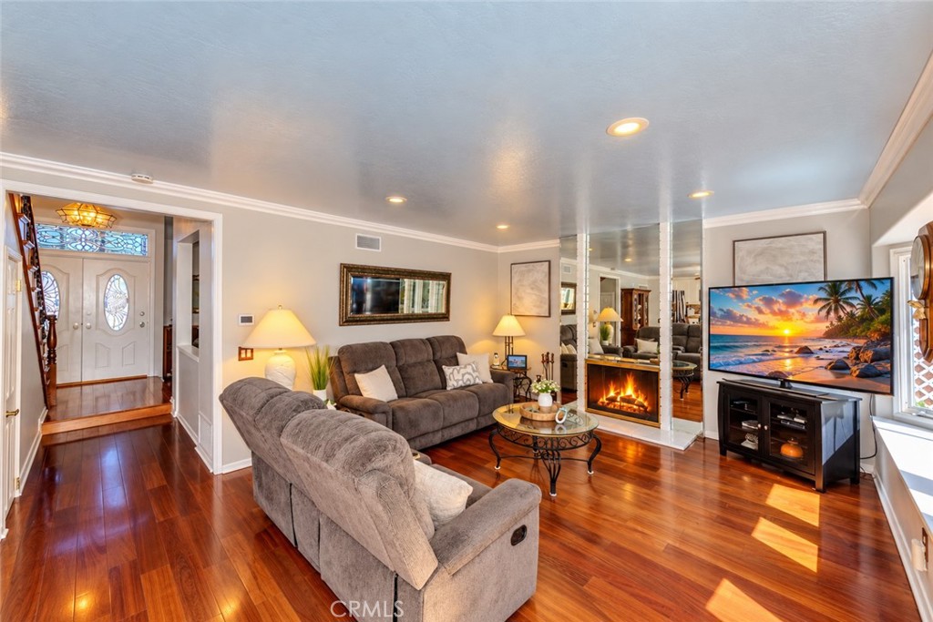 Family Room with Cozy Fireplace. - 8712 Mossford Dr., Huntington Beach CA 92646 - photo 8
