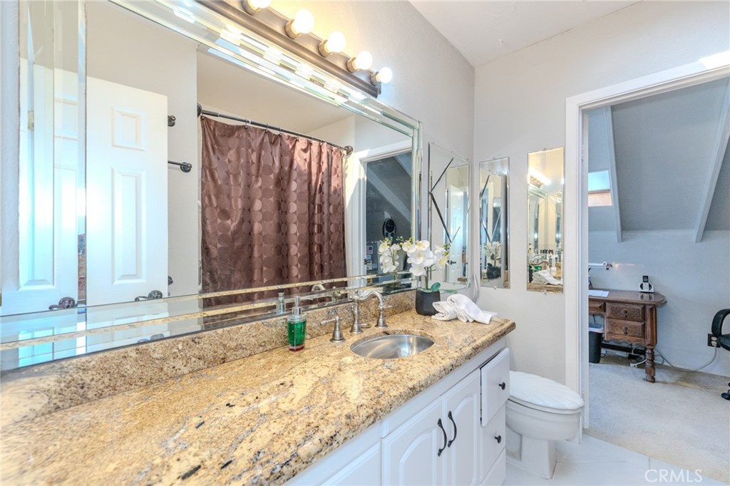 Remodeled Upstairs Hall Bathroom with Granite Countertops - 8712 Mossford Dr., Huntington Beach CA 92646 - photo 31