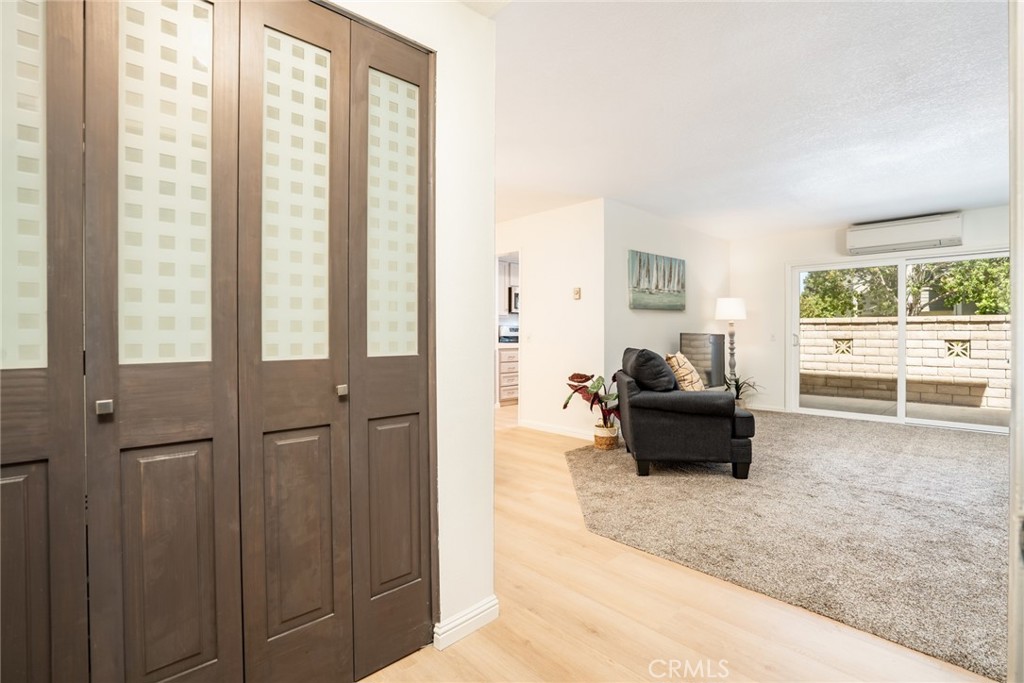 Step inside to enjoy this single-level floor plan featuring brand new hard surface flooring and a private patio with dir - 8777 Coral Springs Court 11B, Huntington Beach CA 92646 - photo 1