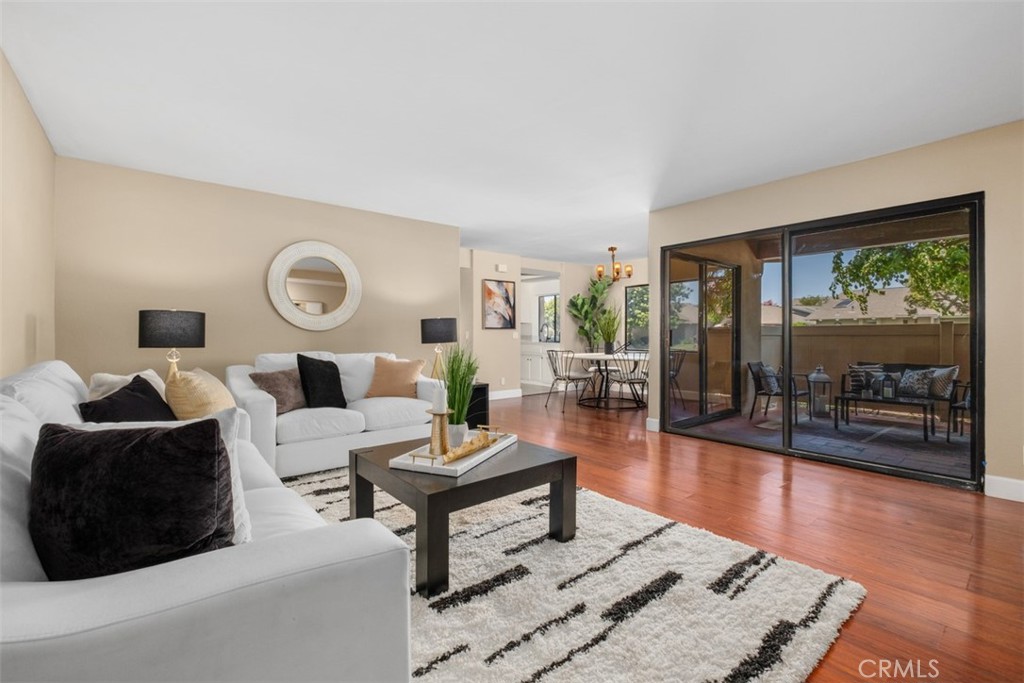 Living Room Open to Kitchen - 8788 Coral Springs Court 205A, Huntington Beach CA 92646 - photo 1