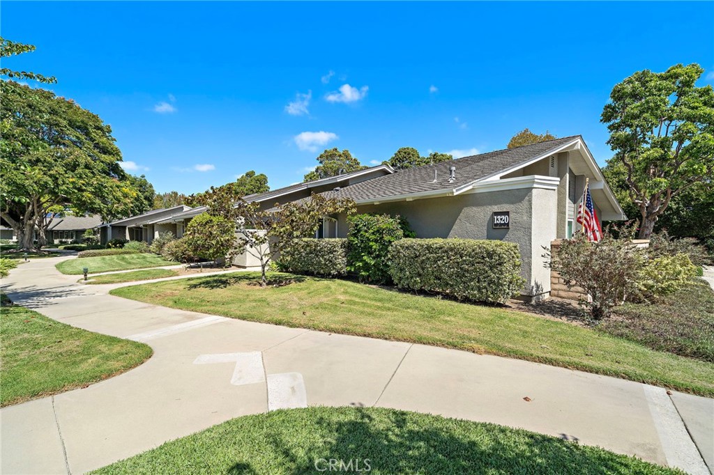View from parking 1320E is the 2nd walkway on the right - 8932 Biscayne Court 1320E, Huntington Beach CA 92646 - photo 2
