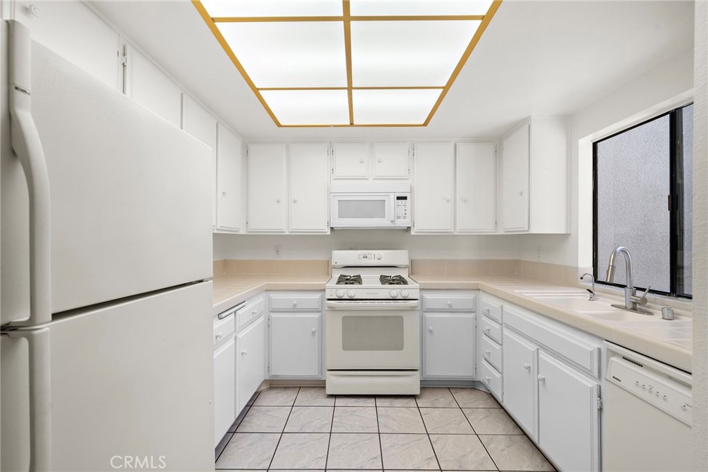 Kitchen includes the refrigerator - 8932 Biscayne Court 1320E, Huntington Beach CA 92646 - photo 7