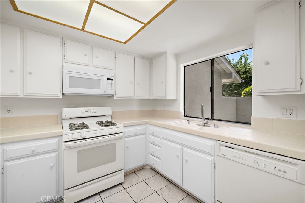 View to the front patio - 8932 Biscayne Court 1320E, Huntington Beach CA 92646 - photo 8