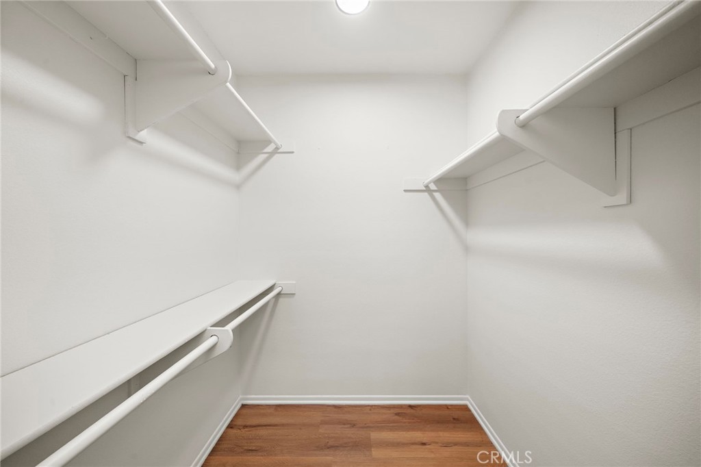 Primary walk-in closet - 8932 Biscayne Court 1320E, Huntington Beach CA 92646 - photo 17