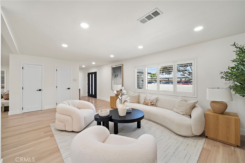Spacious living room provides an inviting setting for everyday relaxation and entertaining. - 9162 Brabham Drive, Huntington Beach CA 92646 - photo 9
