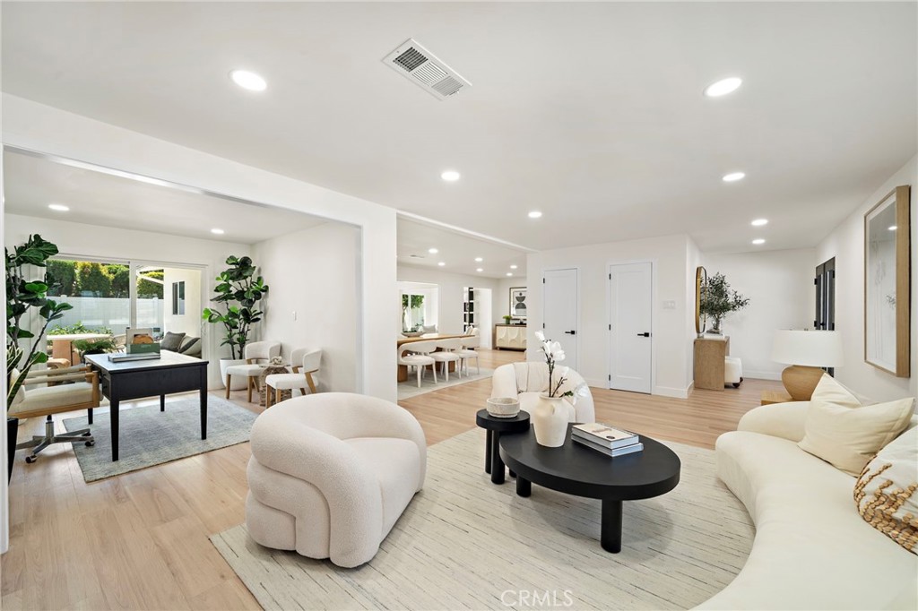Another light-filled living room view highlights the open layout, contemporary finishes and abundant natural light. - 9162 Brabham Drive, Huntington Beach CA 92646 - photo 10