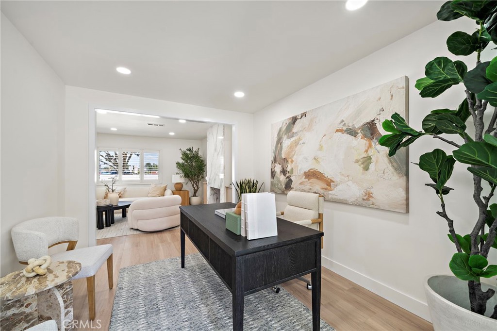 Open-concept main level creates an effortless connection between the living, dining and kitchen spaces. - 9162 Brabham Drive, Huntington Beach CA 92646 - photo 12