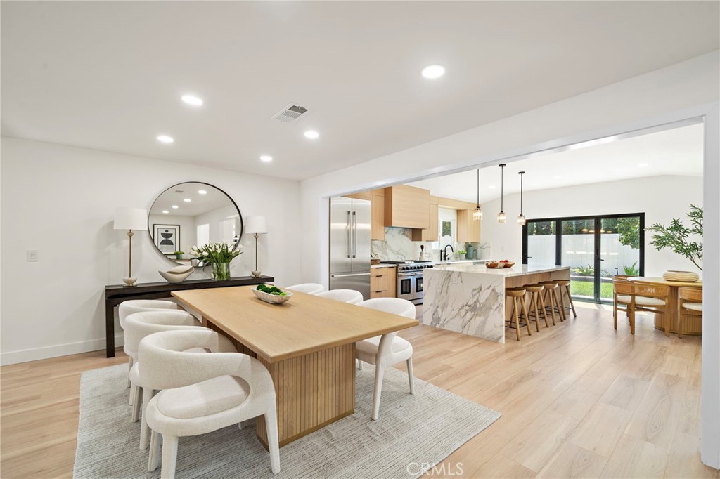 Open dining area enjoys a bright contemporary setting beside the beautifully remodeled kitchen. - 9162 Brabham Drive, Huntington Beach CA 92646 - photo 15
