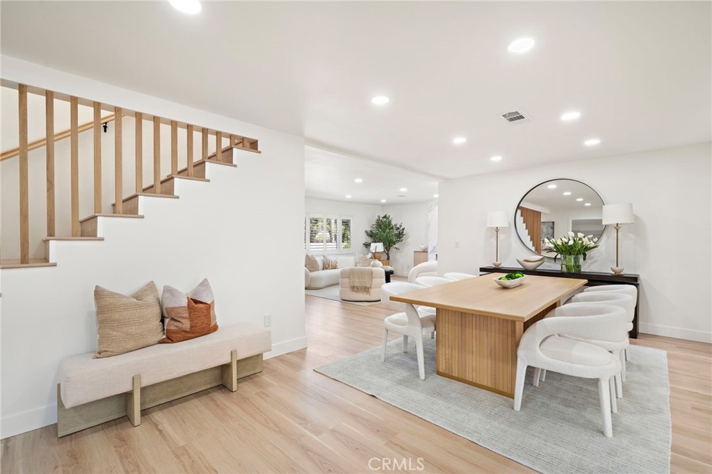 Custom wood-slat staircase adds architectural character to the bright main living area. - 9162 Brabham Drive, Huntington Beach CA 92646 - photo 16