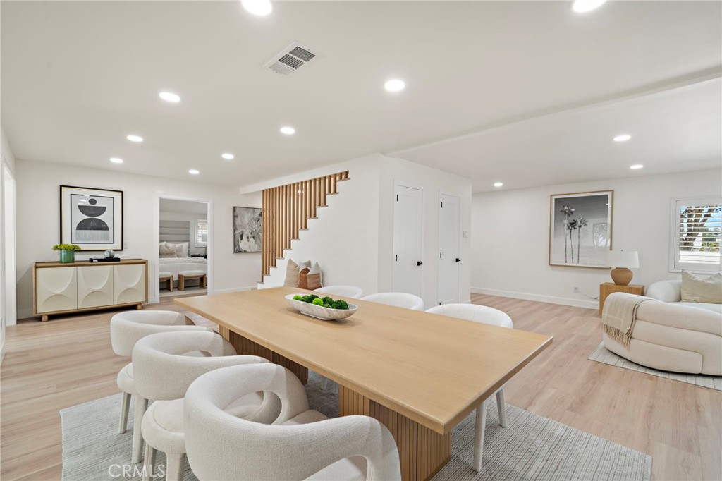 Comfortable living area offers an open sightline toward the dining space and remodeled kitchen. - 9162 Brabham Drive, Huntington Beach CA 92646 - photo 18