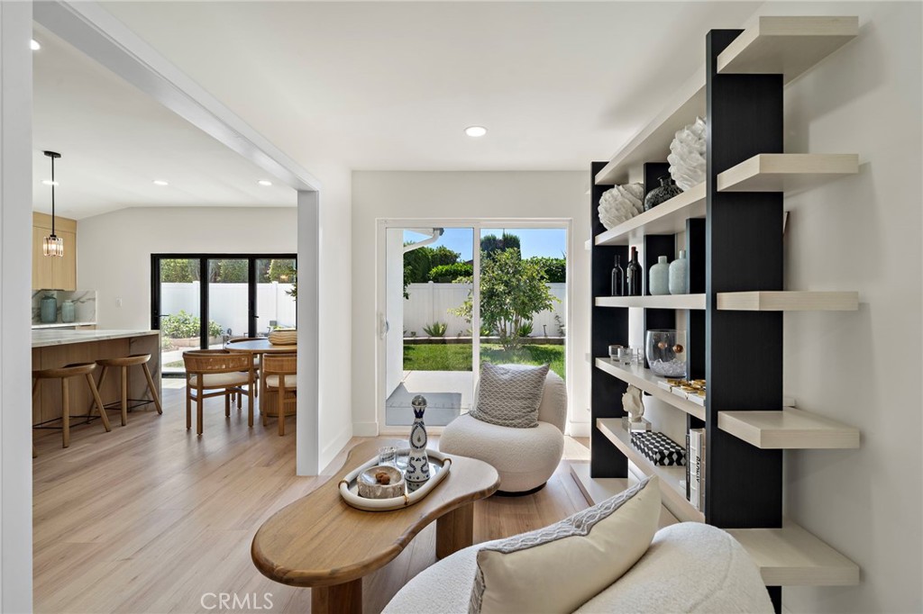 Versatile sitting room provides a quiet retreat with custom built-in shelving and direct backyard access. - 9162 Brabham Drive, Huntington Beach CA 92646 - photo 19