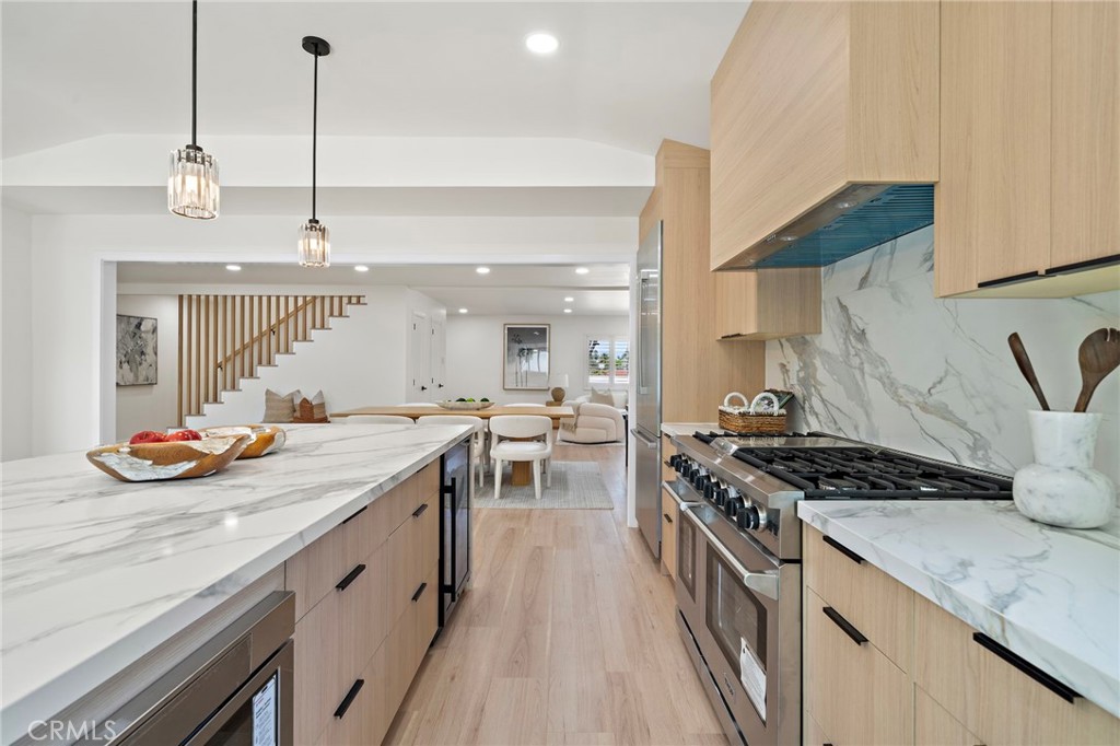 Beautifully remodeled kitchen features quartz and stone surfaces, premium stainless steel appliances and extensive stora - 9162 Brabham Drive, Huntington Beach CA 92646 - photo 24