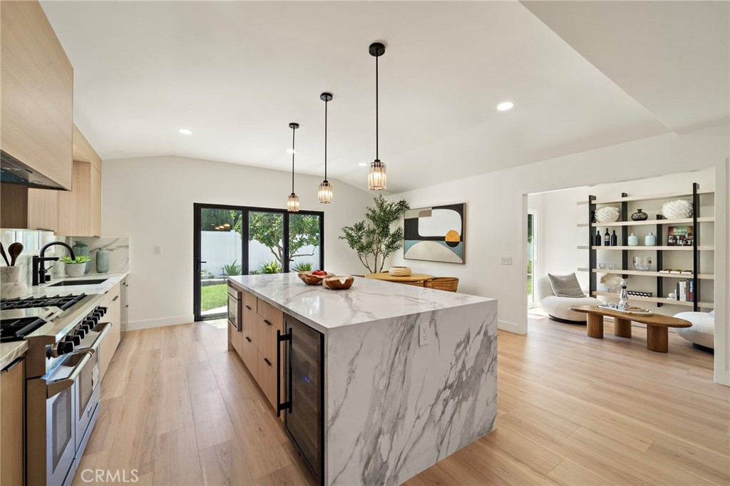 Impressive kitchen island anchors the open-concept space with plentiful seating and preparation room. - 9162 Brabham Drive, Huntington Beach CA 92646 - photo 26