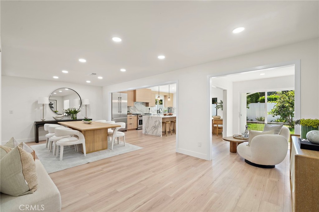 Bright dining and living spaces enjoy wide-plank flooring, recessed lighting and an inviting open layout. - 9162 Brabham Drive, Huntington Beach CA 92646 - photo 28