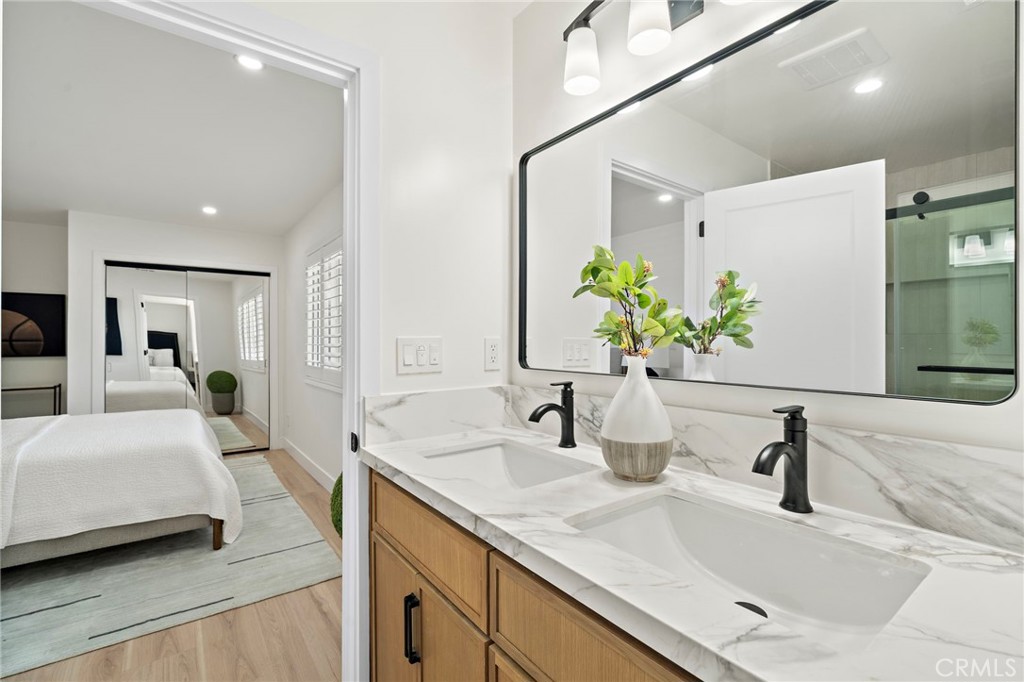 Renovated bathroom features a modern vanity, designer tile and a sleek vessel-style sink. - 9162 Brabham Drive, Huntington Beach CA 92646 - photo 38