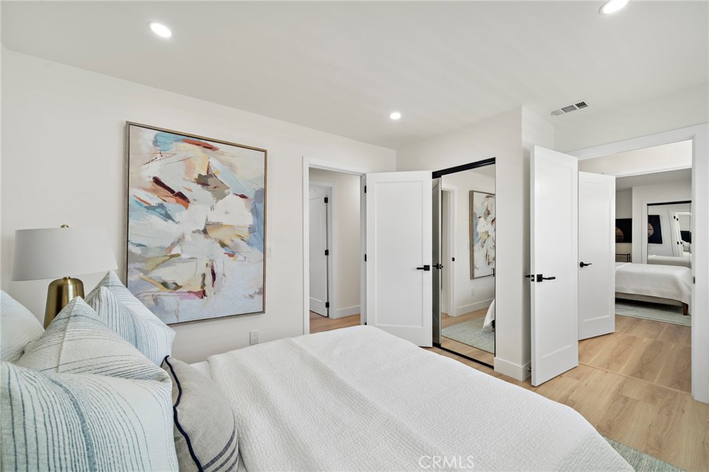 Another upstairs bedroom provides generous space, natural light and convenient access to its bathroom. - 9162 Brabham Drive, Huntington Beach CA 92646 - photo 41