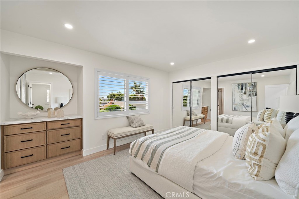 Bright secondary bedroom offers ample space, recessed lighting and a beautifully coordinated neutral design. - 9162 Brabham Drive, Huntington Beach CA 92646 - photo 45