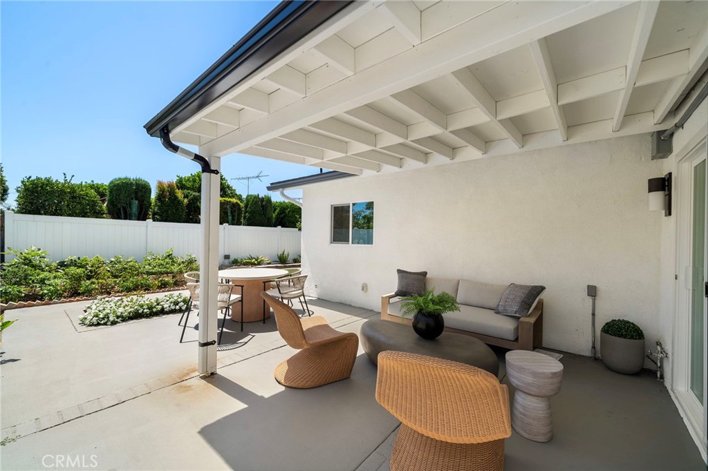 Covered outdoor lounge offers shade, privacy and an inviting setting for year-round relaxation. - 9162 Brabham Drive, Huntington Beach CA 92646 - photo 50
