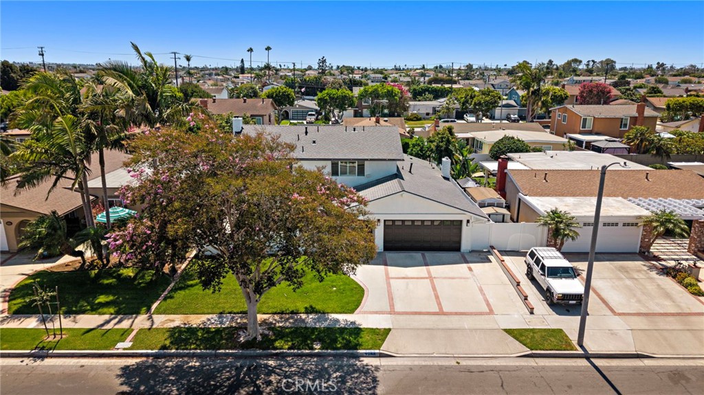 Aerial perspective showcases the home, surrounding neighborhood and nearby coastal area. - 9162 Brabham Drive, Huntington Beach CA 92646 - photo 59