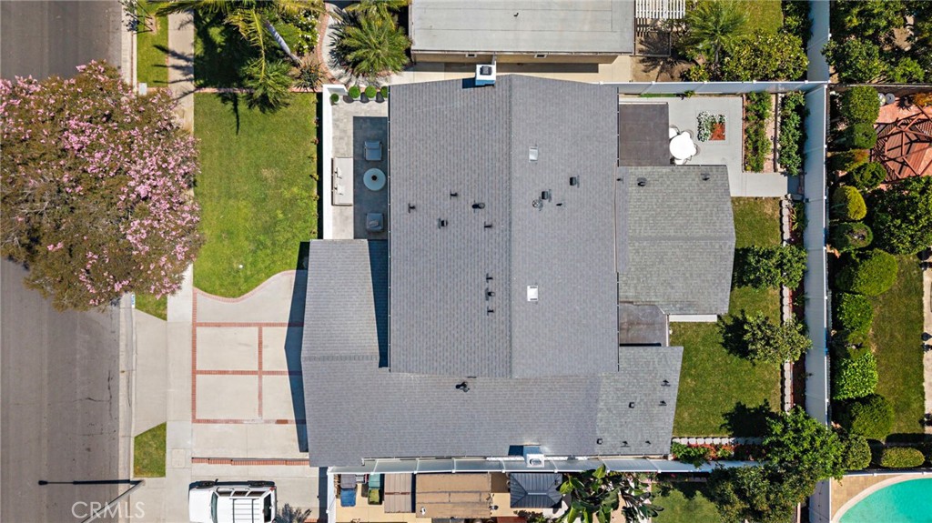 Straight-down aerial view clearly displays the residence, roofline, patios and landscaped grounds. - 9162 Brabham Drive, Huntington Beach CA 92646 - photo 60