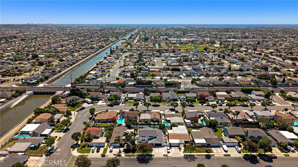 Expansive aerial view showcases the neighborhood, nearby thoroughfares and coastal setting. - 9162 Brabham Drive, Huntington Beach CA 92646 - photo 61
