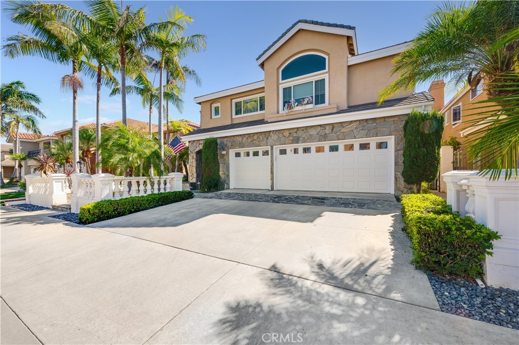 Front with 3 Car Garage and Custom Fence - 9332 Power, Huntington Beach CA 92646 - photo 2
