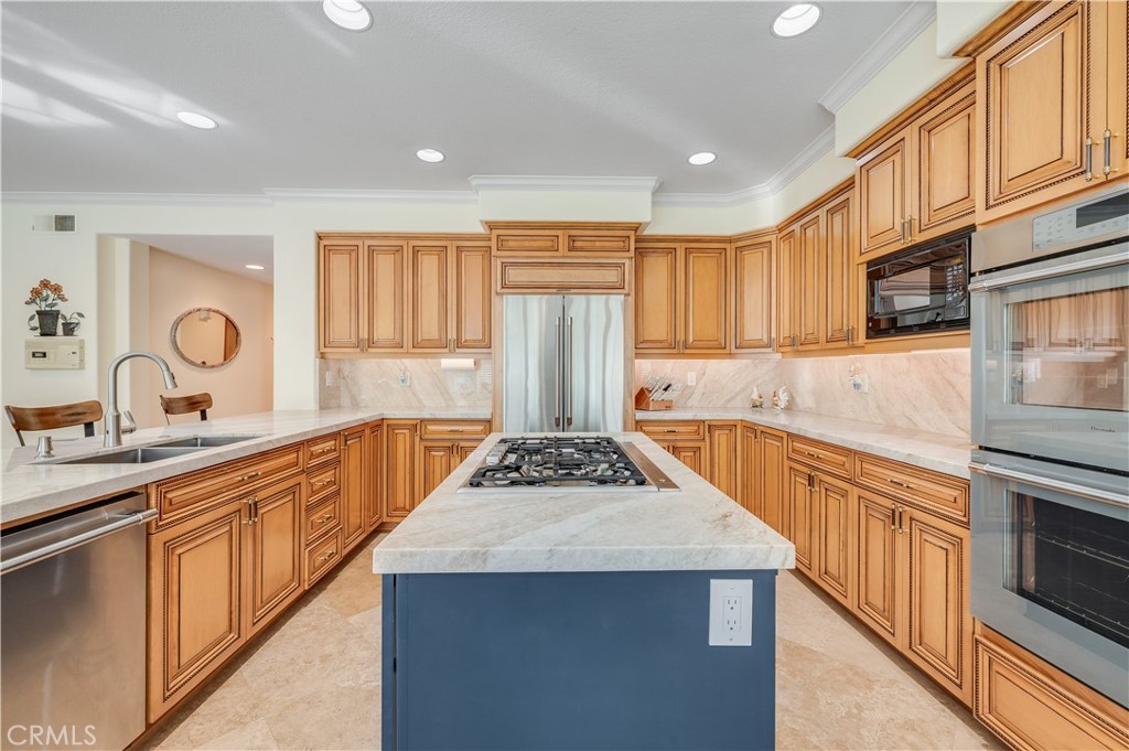 Large Kitchen with Island and a massive amount of Cabinetry - 9332 Power, Huntington Beach CA 92646 - photo 12