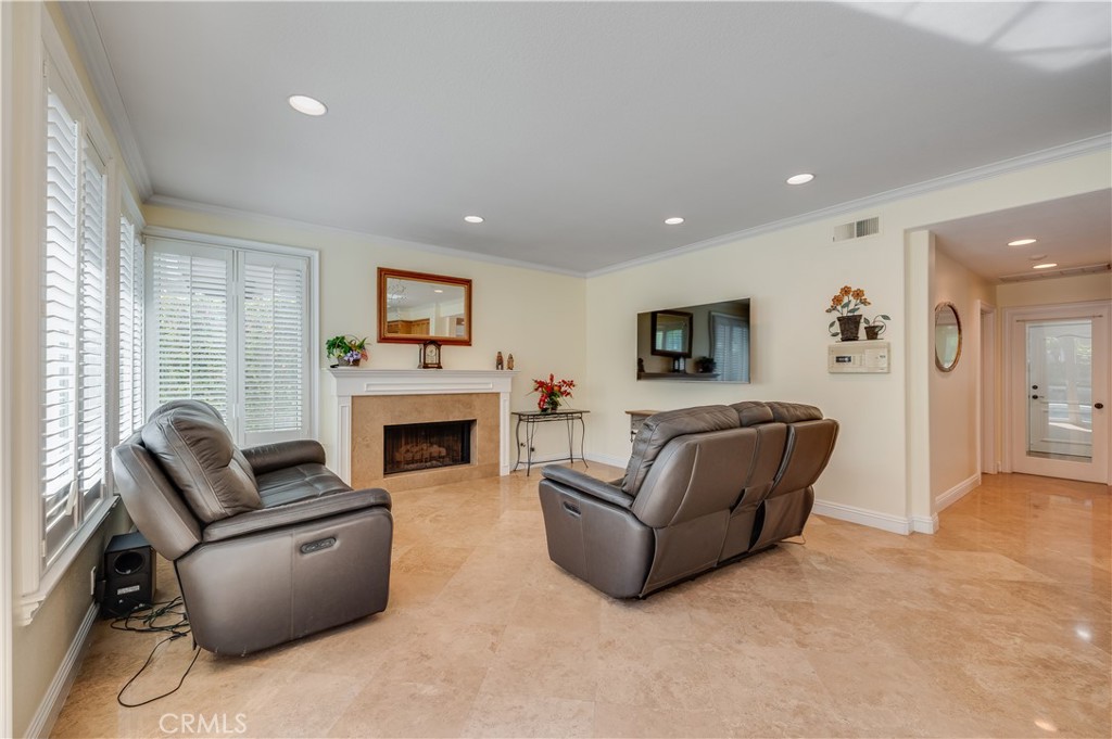 Large Family Room with Custom Shutters and a Large Gas Fireplace - 9332 Power, Huntington Beach CA 92646 - photo 16