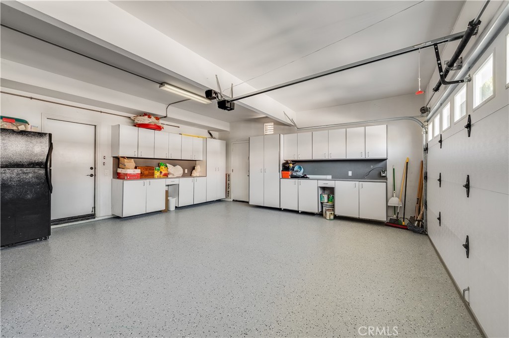 Large 3 Car Garage with lots of Cabinetry and new Epoxy Floors - 9332 Power, Huntington Beach CA 92646 - photo 48