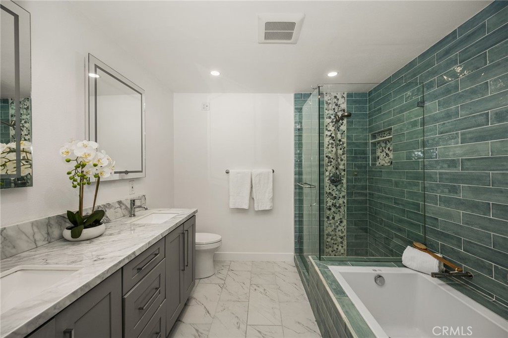 Upgraded upstairs primary bathroom. - 9921 Barranca Circle, Huntington Beach CA 92646 - photo 8