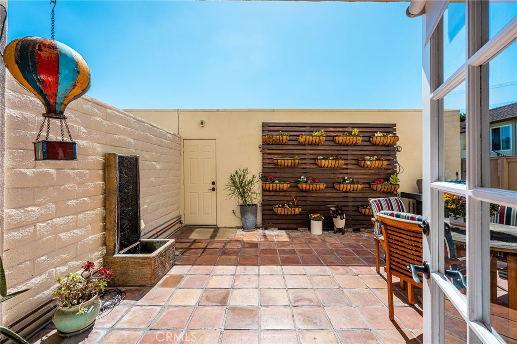 Patio featuring a vertical garden with drip irrigation. - 9921 Barranca Circle, Huntington Beach CA 92646 - photo 9