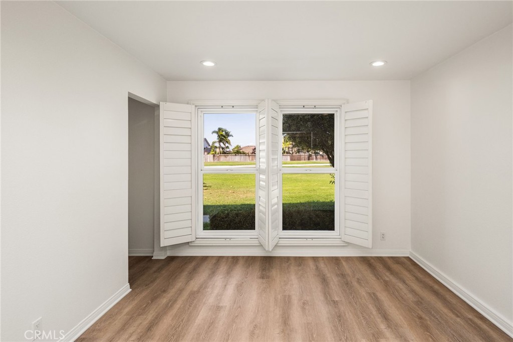 Main-level bedroom with direct access to a full bathroom. - 9921 Barranca Circle, Huntington Beach CA 92646 - photo 32