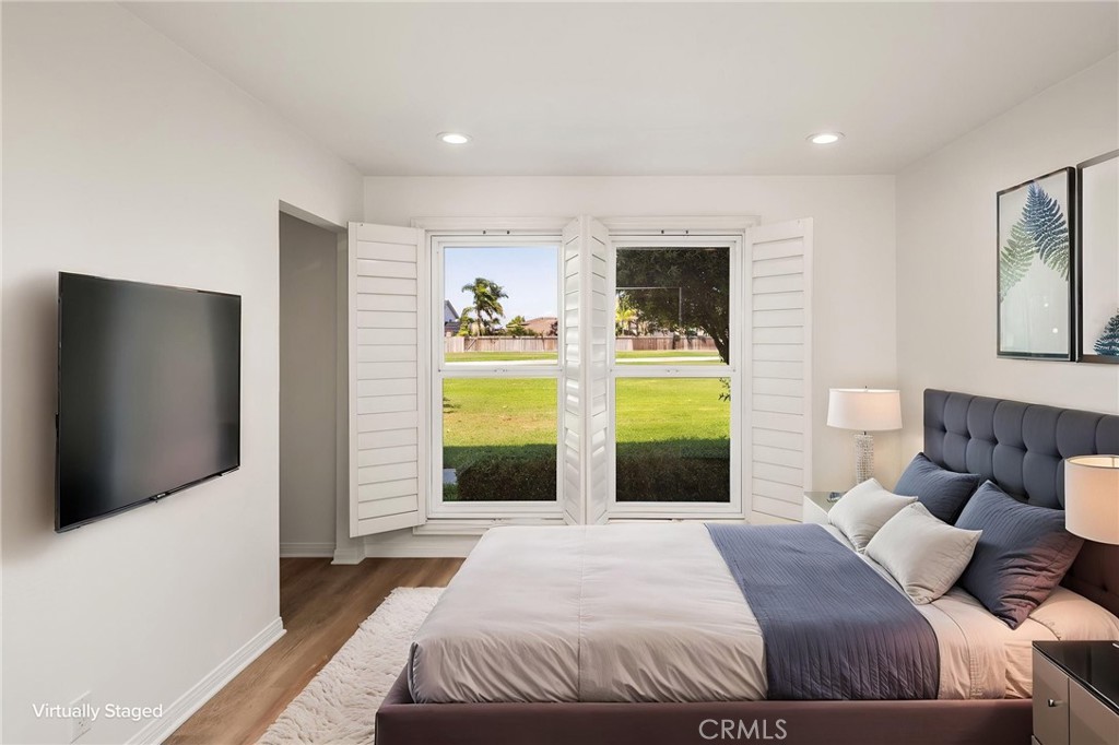 Main-level bedroom virtually staged - 9921 Barranca Circle, Huntington Beach CA 92646 - photo 33