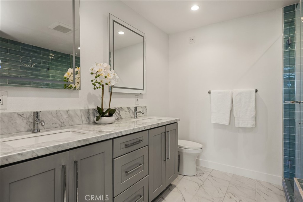 Upstairs primary bathroom. - 9921 Barranca Circle, Huntington Beach CA 92646 - photo 45