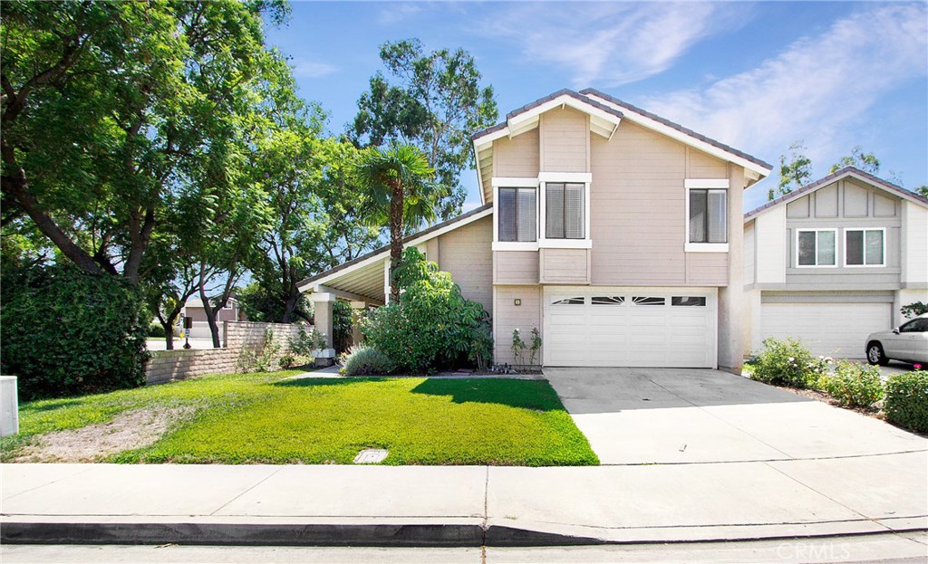 Elevation of the home-corner lot-tree lined - 1 Christamon W, Irvine CA 92620 - photo 1