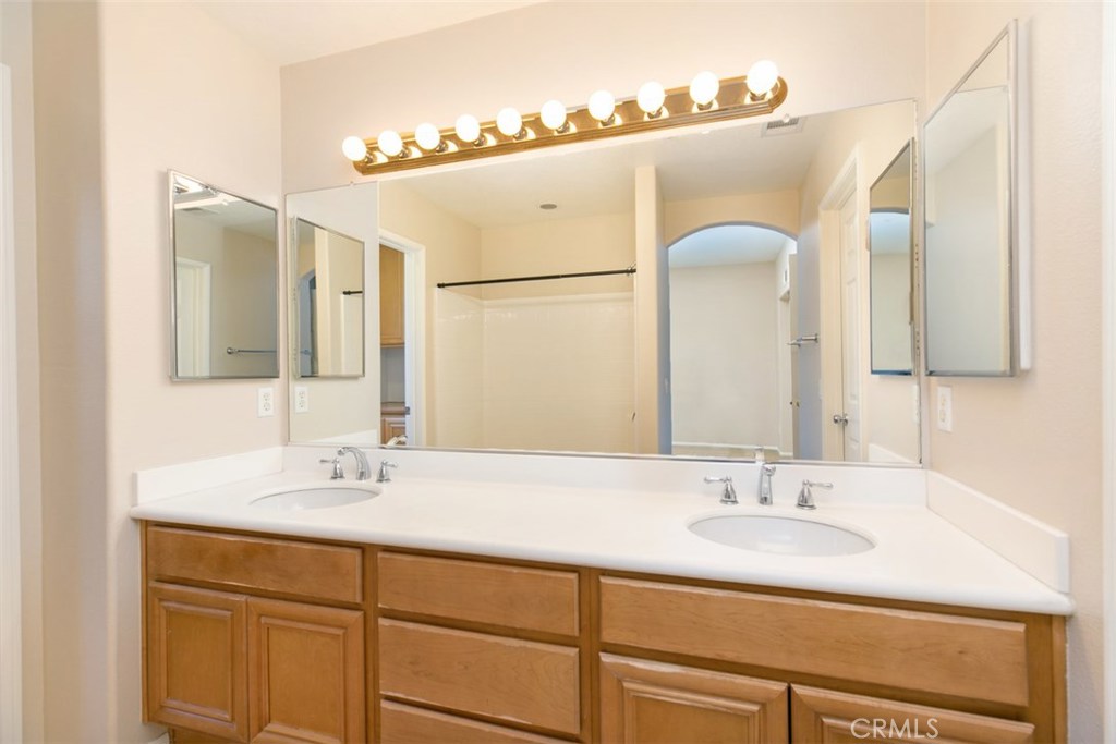 Master bathroom, with dual vanities, tub, shower, and walk-in closet. - 10 New Market, Irvine CA 92602 - photo 10