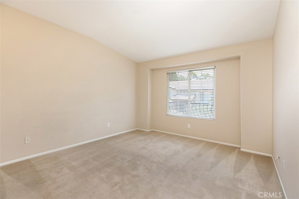 Secondary bedroom. *flooring to be updated with LVP prior to move-in. - 10 New Market, Irvine CA 92602 - photo 11
