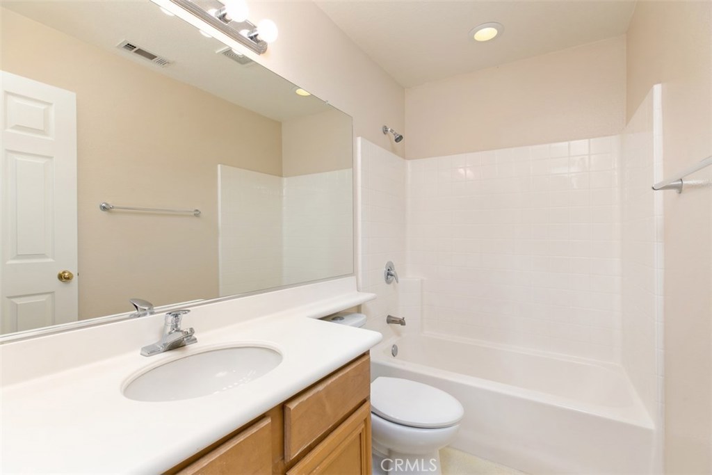 Upstairs hallway bathroom, with shower over tub, and single faucet/sink. - 10 New Market, Irvine CA 92602 - photo 14