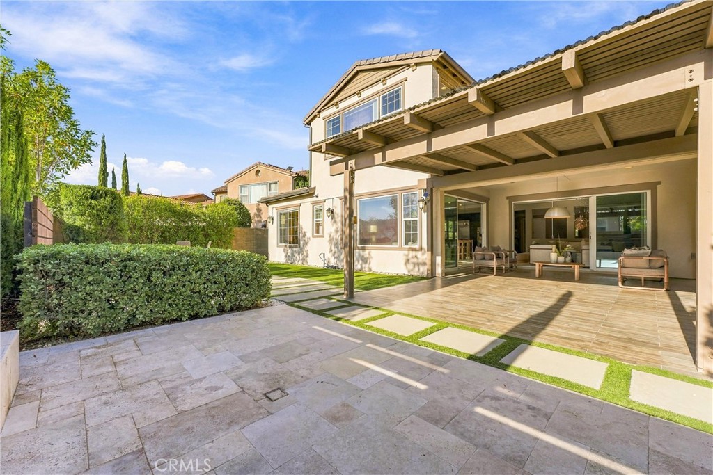 Outdoors, the beautifully landscaped backyard is designed for effortless Southern California living, featuring an expans - 104 Sparrow, Irvine CA 92618 - photo 26