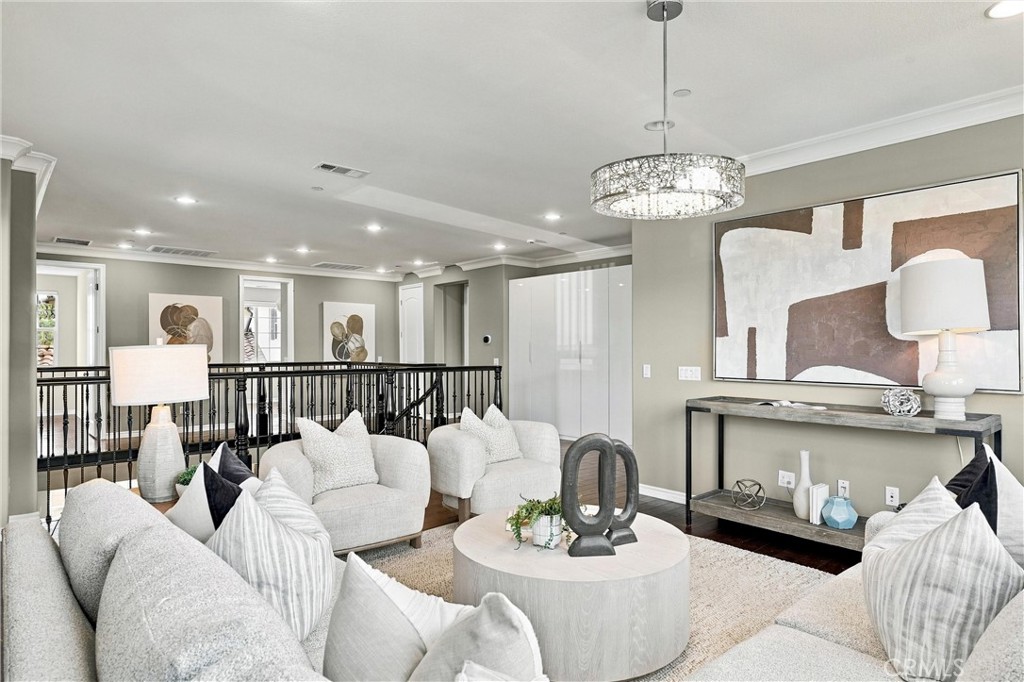 Upstairs, a generous loft offers additional space for relaxation or recreation. - 104 Sparrow, Irvine CA 92618 - photo 36