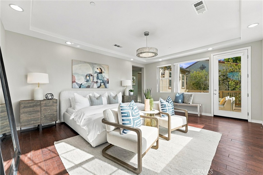 An expansive primary suite serves as a private retreat, complete with a spacious bathroom, soaking tub, separate shower, - 104 Sparrow, Irvine CA 92618 - photo 42