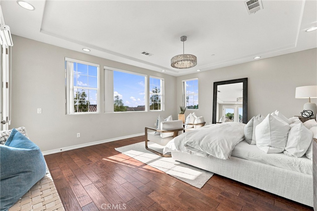 An expansive primary suite serves as a private retreat, complete with a spacious bathroom, soaking tub, separate shower, - 104 Sparrow, Irvine CA 92618 - photo 43