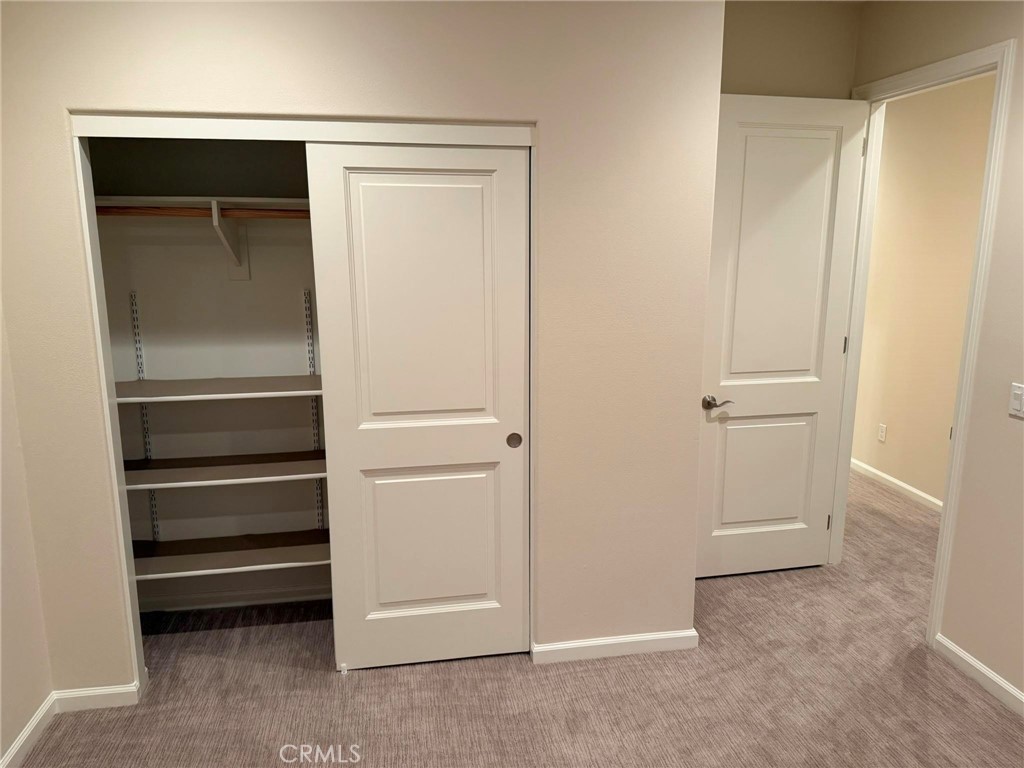 Bedroom 3 closet. - 104 Strawberry Grove, Irvine CA 92620 - photo 13
